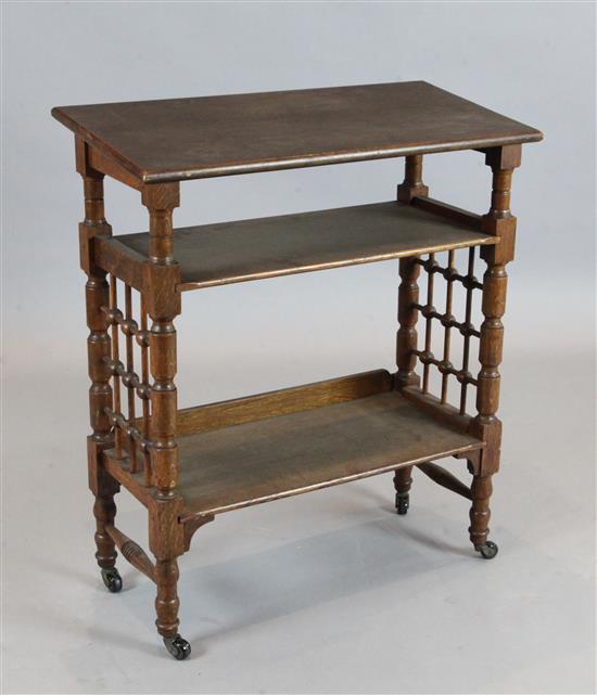 Attributed to Leonard Wyburd. A Liberty & Co oak book table, W.2ft 4in. D.1ft 1in. H.2ft 8in.